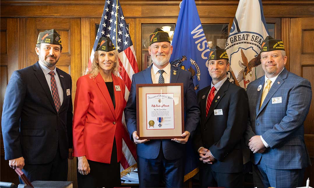 VFW members present Rep Derrick Van Orden with a citation