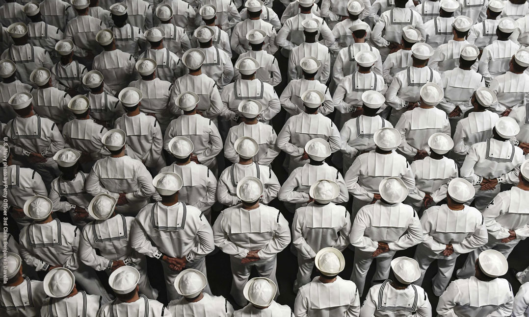 U.S. Navy personnel stand at attention during a change of command ceremony.