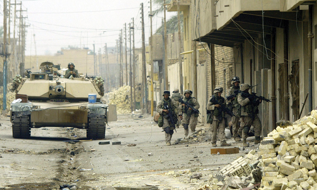 Marines of Kilo Company, 3rd Battalion, 5th Marines, conduct a house-to-house search in Fallujah on Nov. 17, 2004