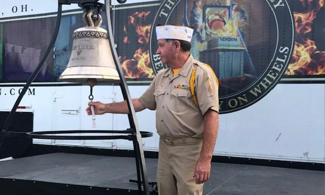 VFW member strikes the new Mayflower II bell during a ceremony