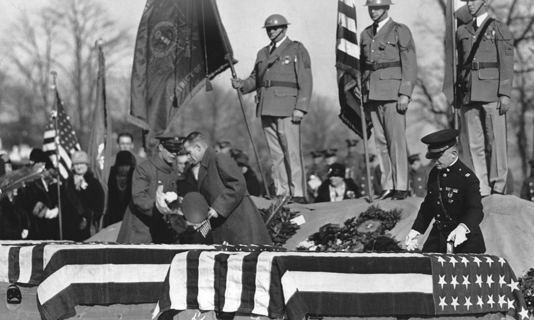 VFW Department of Washington, D.C. Commander Harvey Miller places Crosses of Malta on caskets of three “Polar Bears” after their remains returned stateside in November 1929 at Arlington National Cemetery 