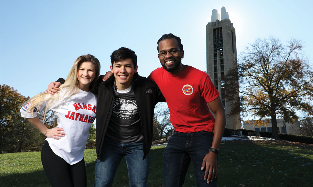 University of Kansas Student Veterans of America Chapter Vice President of Media Kylie Coffelt, Vice President of Finance Mike Ellis and President Omar Williams hang out on campus in front of the Campanile, a WWII memorial, in November in Lawrence, Kan. SVA chapters across the country advocate for improvements to benefits for the more than 700,000 student veterans on its campuses.