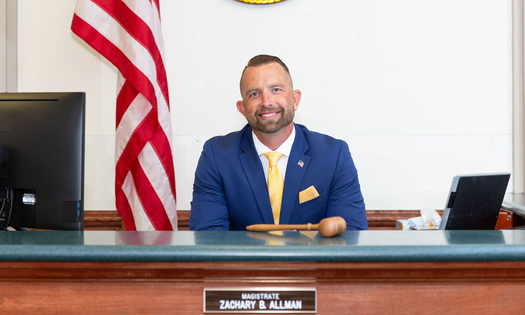 Iraq Veteran Zachary Allman sits at his bench as magistrate in West Virginia