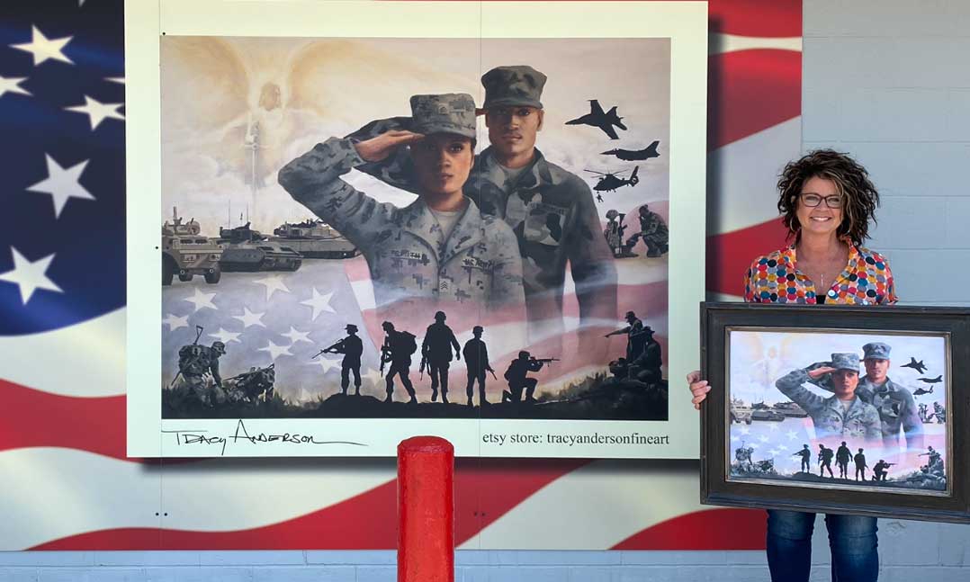 Artist Tracy Anderson stands next to the 12-foot-by-8-foot mural she painted on VFW Post 936 in Alexandria, Minnesota