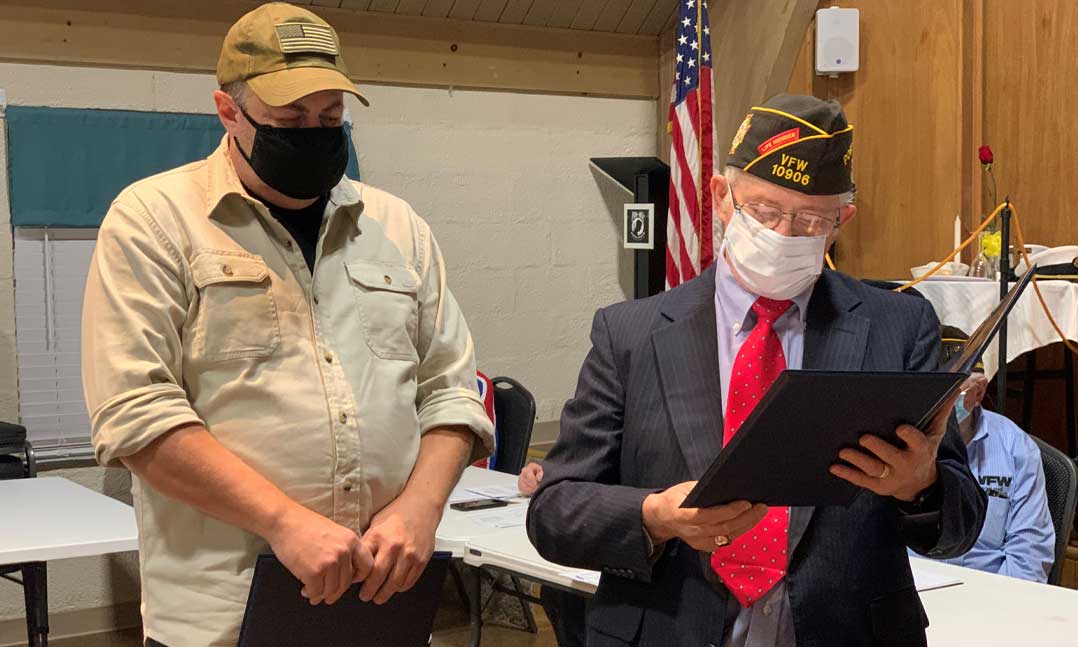 Brett Rankin, father of Sgt. Tyler Rankin, listens to his son’s citation for the VFW Life Saving Award from 10906 Post Commander Ed Oliver on Oct. 13 in Gladstone, Mo. 