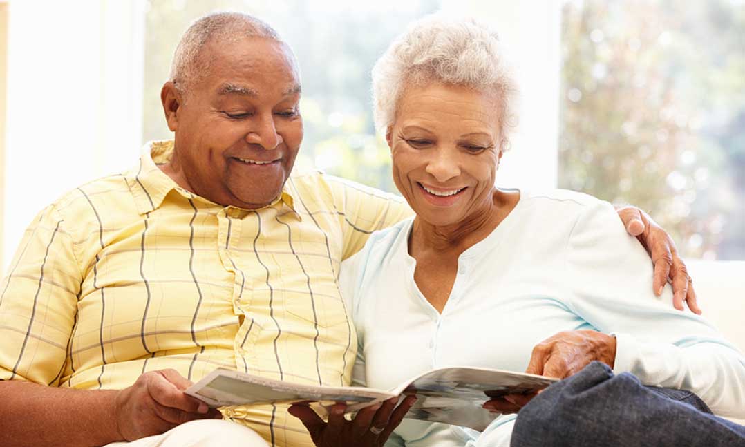 Man and woman looking at a magazine