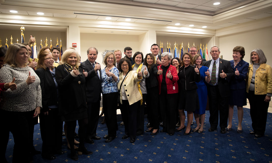 Veterans, congressional leaders and spouses impacted by the widow's tax celebrate the passing of the National Defense Authorization Act of 2020 on Dec. 20 at the VFW Washington Office on Capitol Hill.