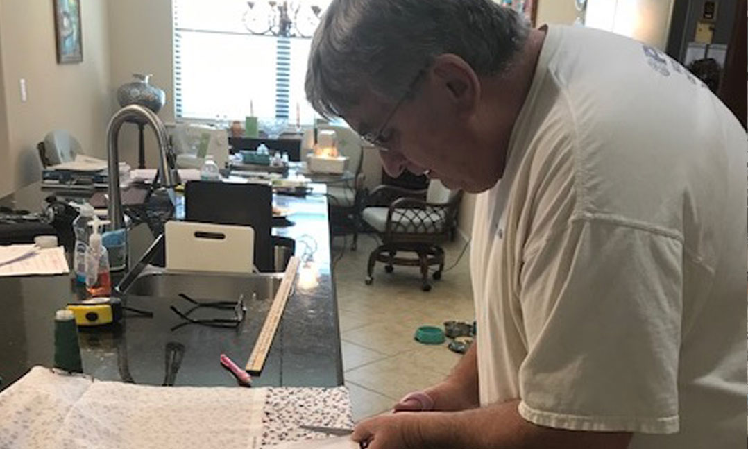 Past VFW National Commander Brian Duffy sewing masks for medical professionals and first responders