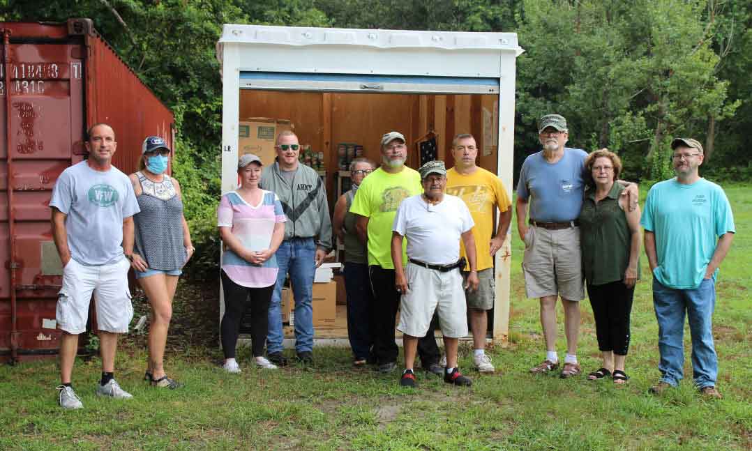 VFW members stand in front of food collected for local pantry during COVID-19 pandemic