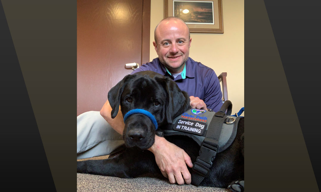 Army veteran Brett Hurlburt and his service dog, Roty.