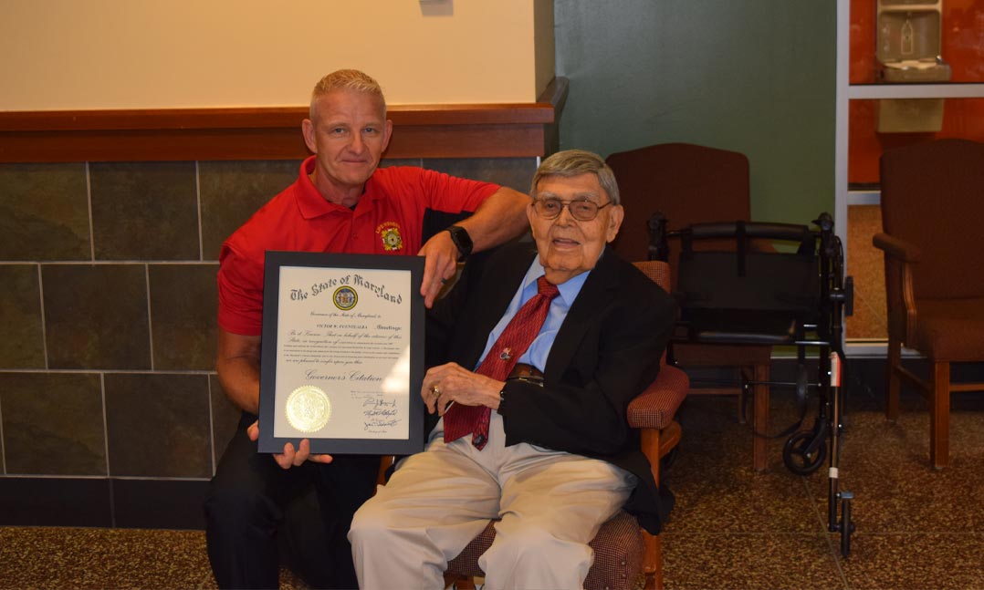 A World War II veterans receives a VFW citation on his 100th birthday