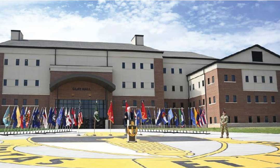 Retired Lt. Gen. Bennet Sacolick speaks in front of the special warfare center on June 23 at North Carolina’s Fort Bragg