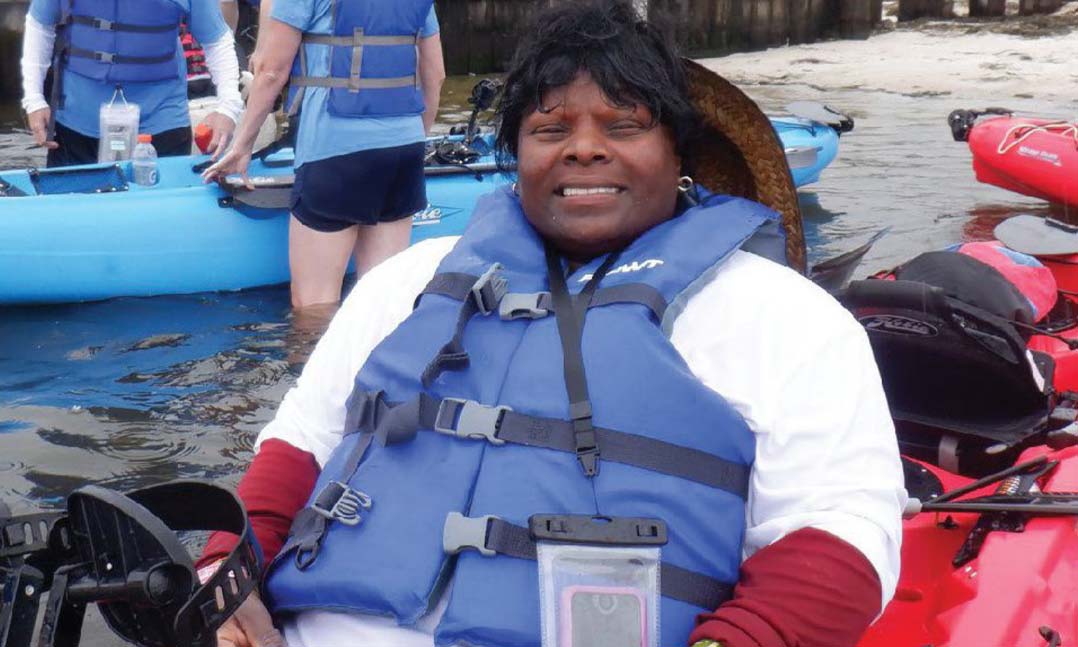 Army veteran Donna Zephrine peddles her kayak near Long Island, New York