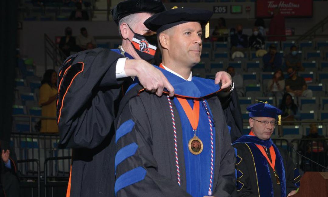 Marine Command Sgt. Maj. Collin Barry receives his doctoral hood in May 2021