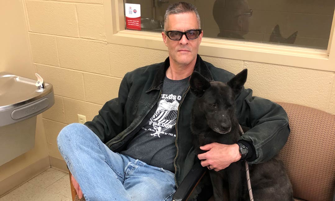 VFW Post 3769 Quartermaster Darian Hylton of Pikeville, Ky., poses with one of his favorite canines, Dakata