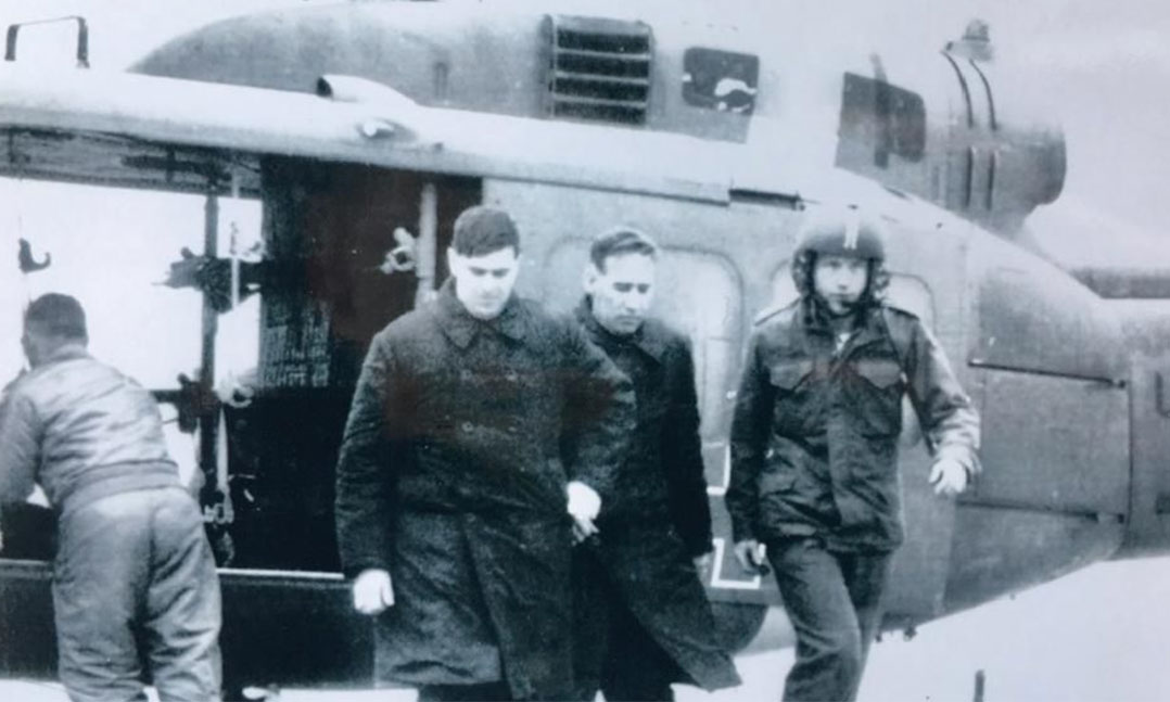 Army Capt. David Crawford, second from left, and Warrant Officer Malcolm Loepke are escorted from a helicopter in December 1969 at the Army’s 121st Evacuation Hospital west of Seoul, South Korea.