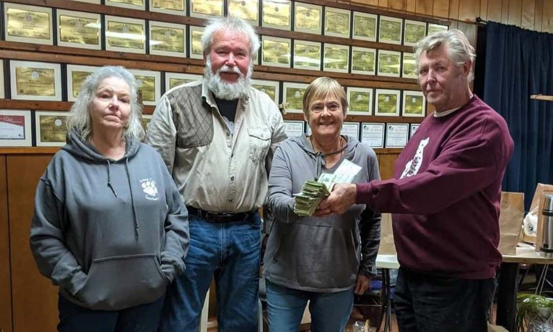 A group of veterans collects money for a fundraiser to support a local animal shelter