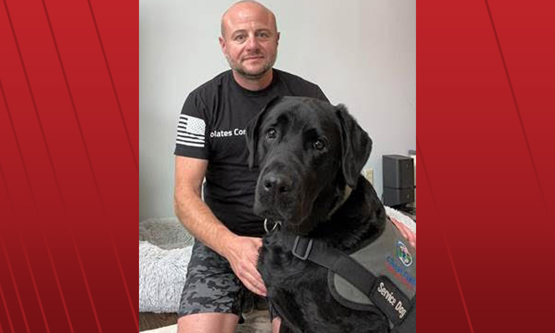 Veteran Brett Hurlburt and his service dog Rotary