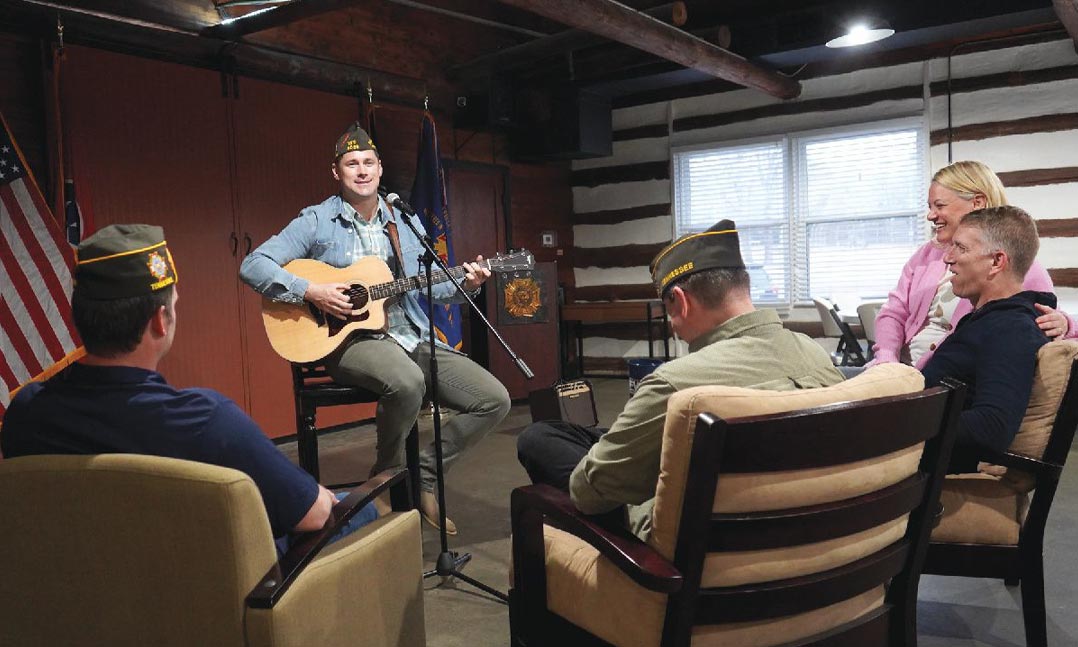 Chris Nurthen, a member of VFW Post 5066 in Collierville, Tennessee, entertains VFW members and guests in April at the VFW Post