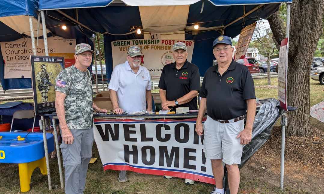 Members of VFW Post 10380 in Green Township, Ohio, man a VFW booth