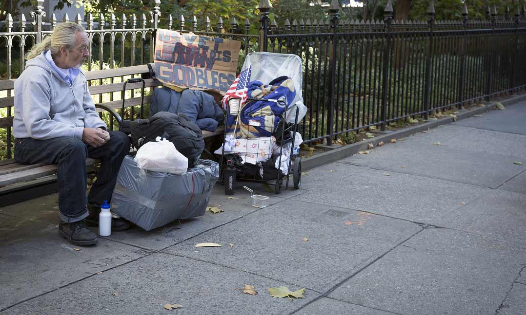 homeless veteran sitting on a bench