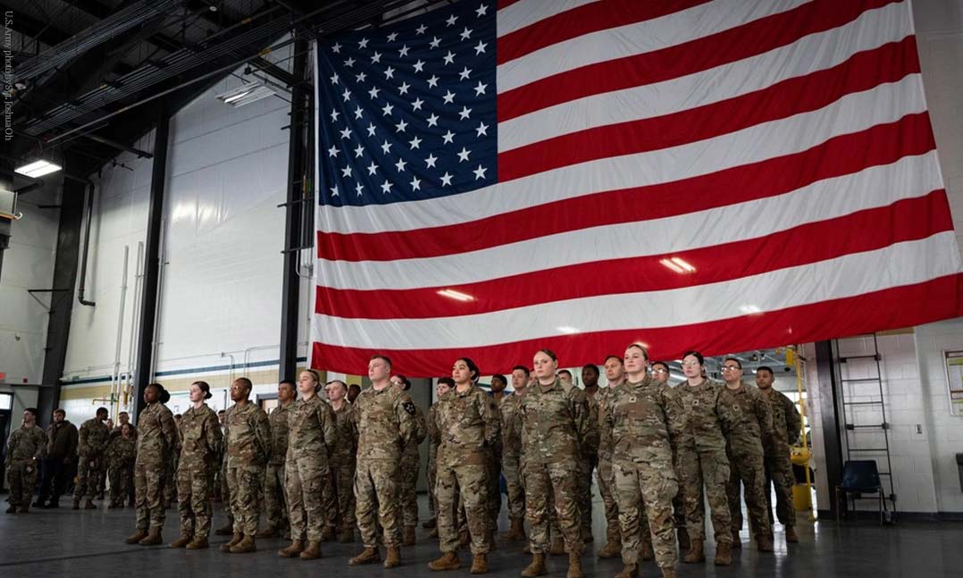 Soldiers from multiple units across Joint Base Lewis-McChord stand ready for a reenlistment ceremony