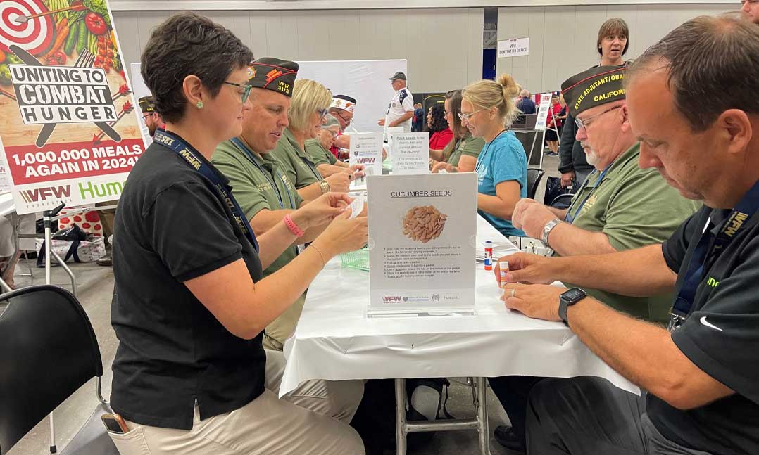 Veterans donate their time sorting seeds for community gardens