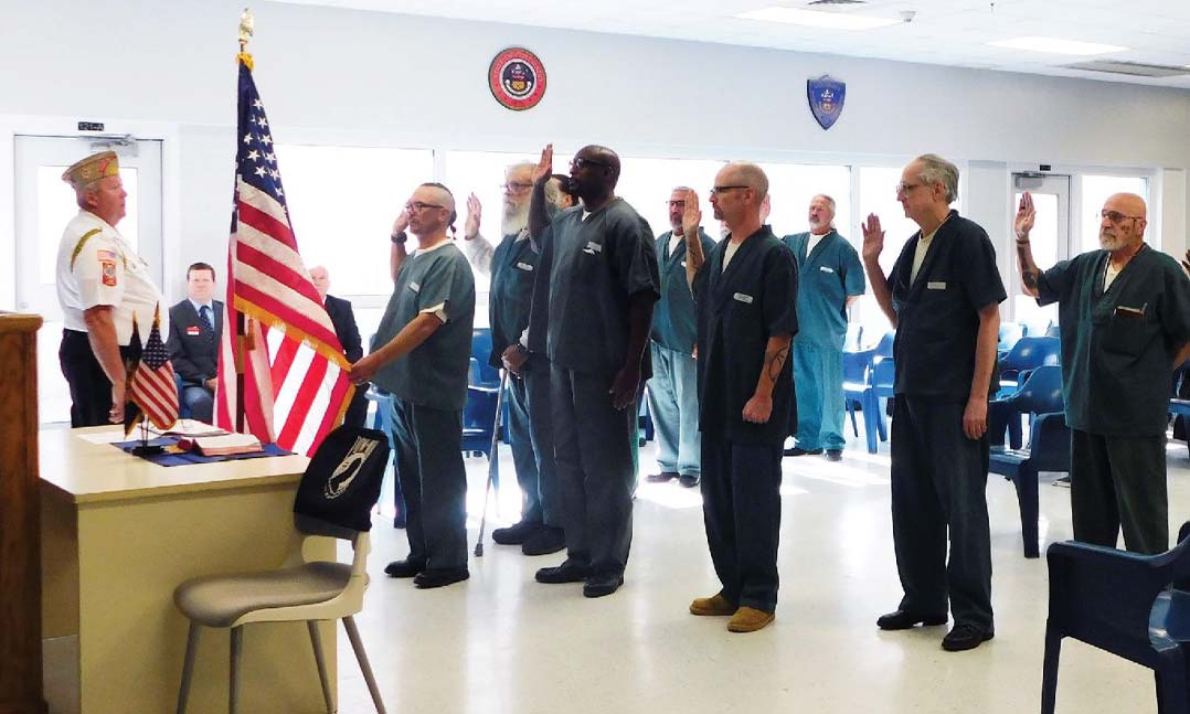 Then-VFW Department of Colorado Chief of Staff Jim Sheridan leads charter members of VFW Post 12226 in the Post’s institution ceremony