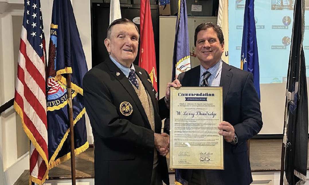 VFW Post 7383 member Larry Dandridge, left, accepts the Commendation of Meritorious Servic