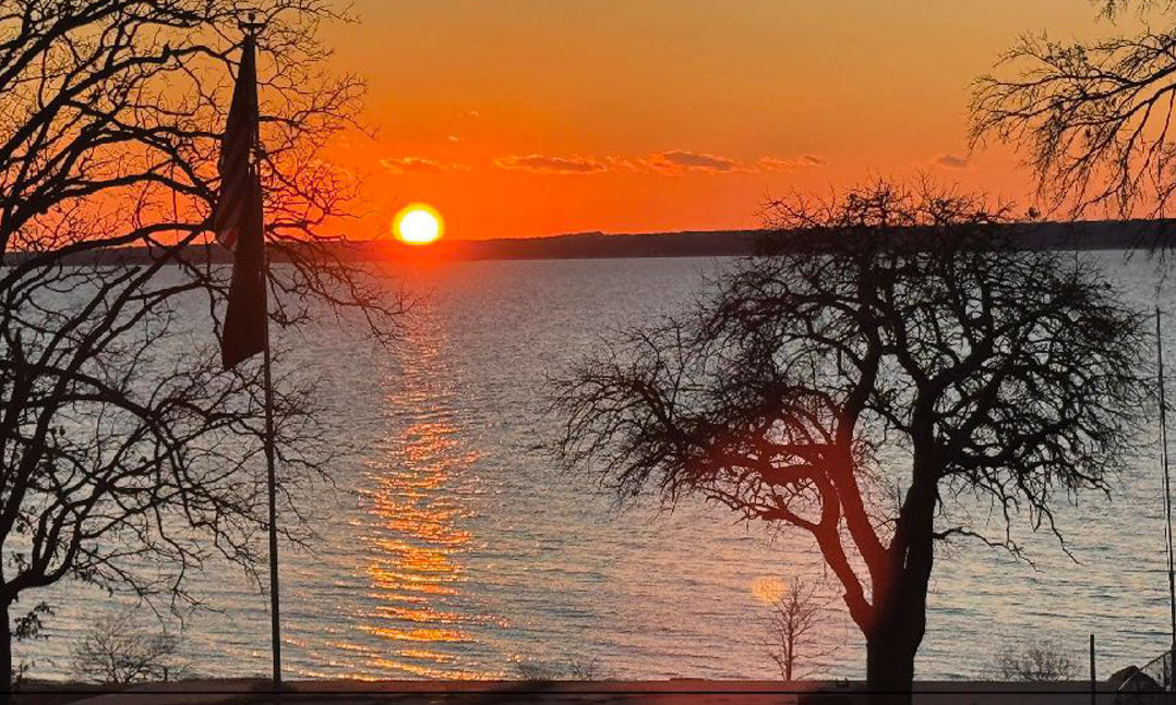 Standing on the back porch of VFW Post 7873, one would get this view of Lake Texoma in Preston, Texas. “Sunset Point,” 