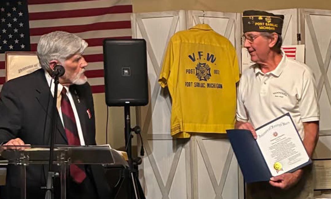 VFW Department of Michigan Adjutant Barry Walter, left, presents VFW Post 8872 Commander Roger Bobby, right, with a certificate of recognition