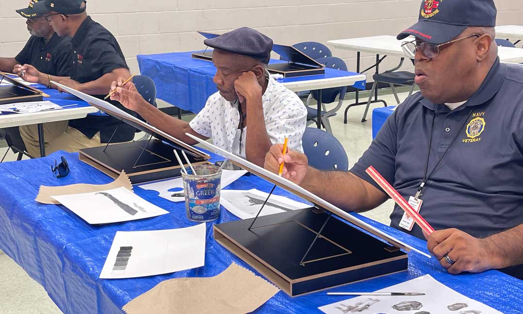 Members of VFW Post 12196 participate in a painting class