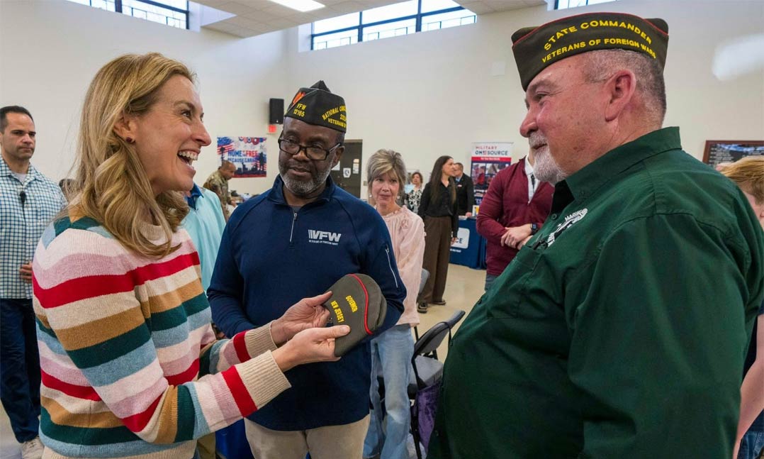 New Jersey Gov. Mikie Sherrill, left, receives a VFW cap 