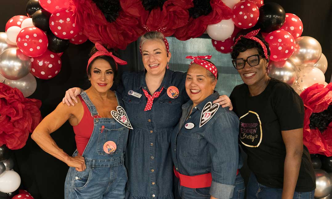 Air Force veteran Edie Davis, Air Force veteran and founder of Women Veteran Calander Mae Saucedo, Navy veteran Sandra Escobedo and Army veteran and Friendship is the New Pretty 2 founder Lori Julian dress as Rosie the Riveter