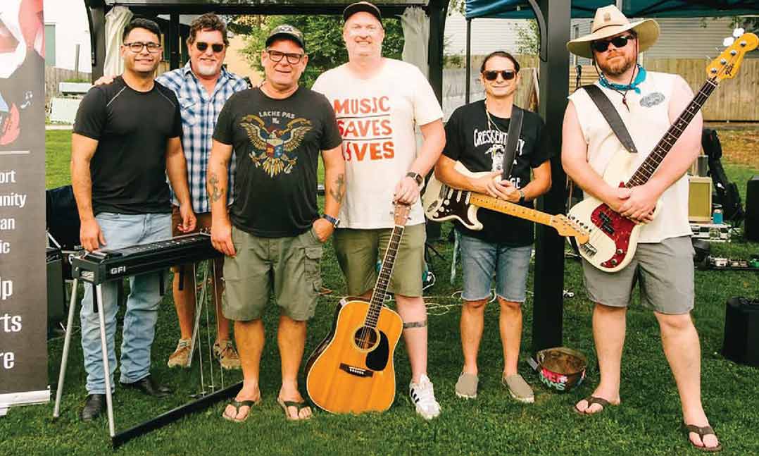 members of Vet Jams gather July in 2025 for a live show